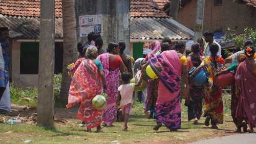 Women carrying water pots in Ramapura village of Mundgod amid severe drinking water shortage in Uttara Kannada district.