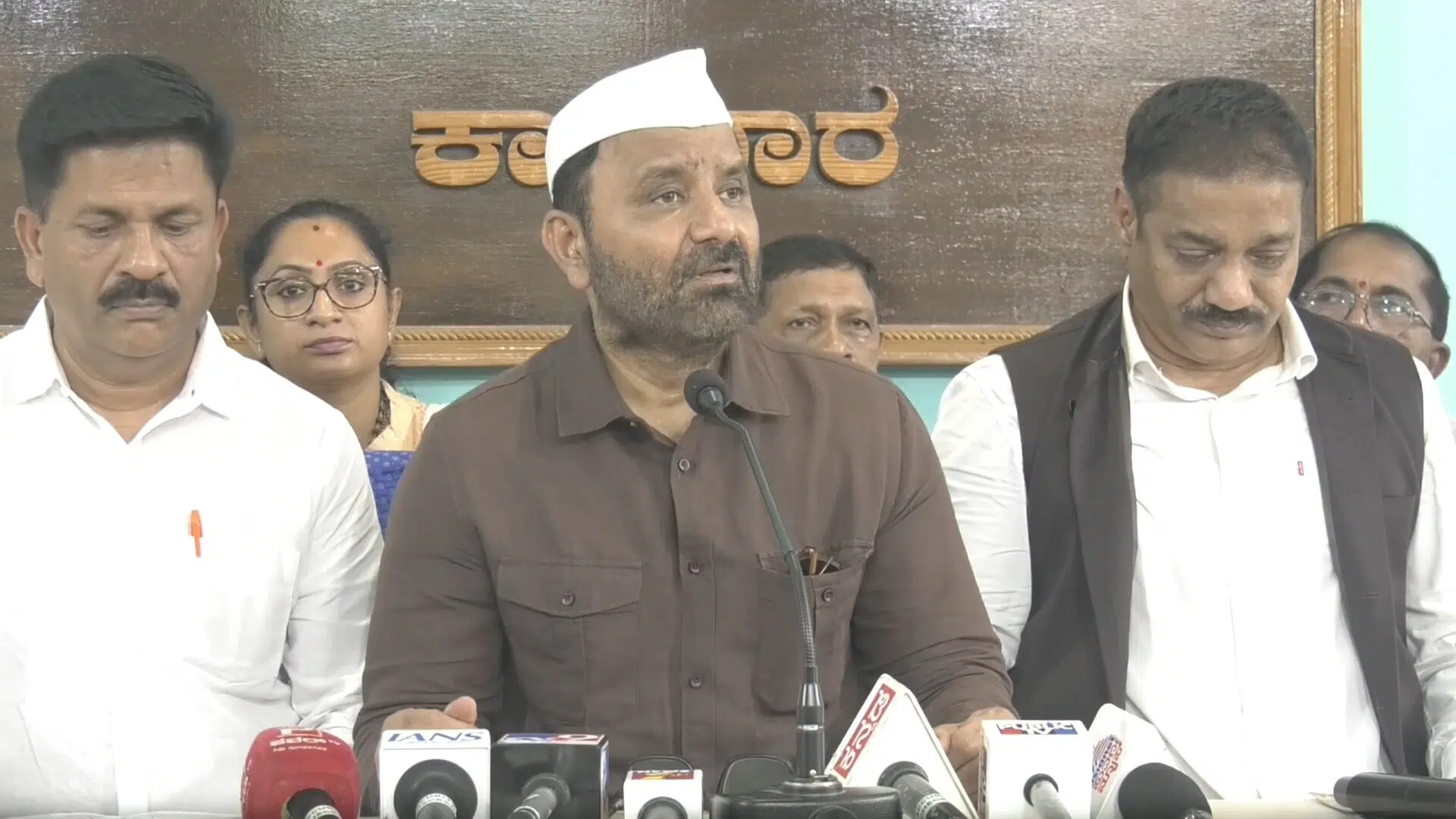 Karnataka Minister Santosh Lad addressing the media at a press conference in Karwar over the controversy surrounding the sting operation.